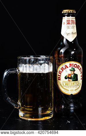 Can Of Birra Morreti Beer And Beer Glass On Dark Background. Illustrative Editorial Photo Shot In Bu