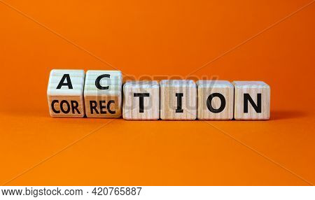 Action Or Correction Symbol. Turned Wooden Cubes And Changed The Word Correction To Action. Beautifu