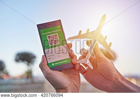 Smartphone Displaying On App Mobile Valid Digital Green Vaccination Certificate For Covid-19 And Air