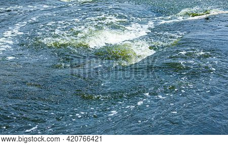 The Texture Of Water On The Surface Of A Small Waterfall In The Ukrainian Steppe Close-up. Tokovsky