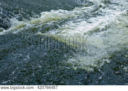 The Texture Of Water On The Surface Of A Small Waterfall In The Ukrainian Steppe Close-up. Tokovsky
