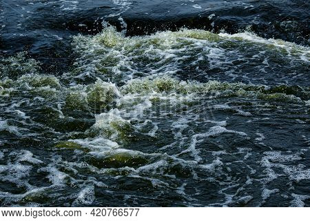 The Texture Of Water On The Surface Of A Small Waterfall In The Ukrainian Steppe Close-up. Tokovsky