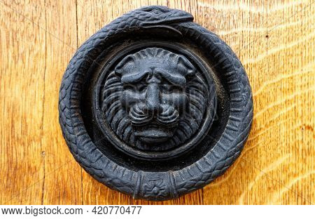 European Vintage Old Metal Wrought Iron Door Knocker. Design Detail. Paris.