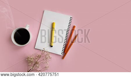Cup Of Coffee. Flower Of Gypsophila, Notepad On Colored Background