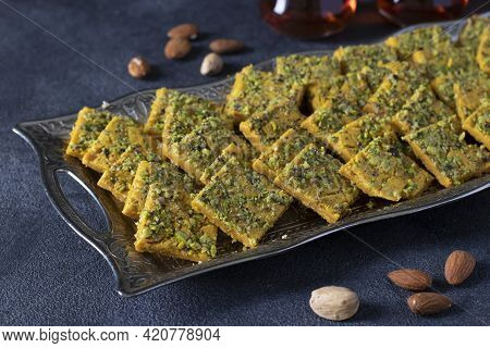 Traditional Persian Dessert Sohan From Iran. Tea Ceremony With Sohan On Dark Gray Background. Close-