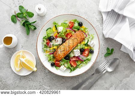 Salmon Fish Salad. Fresh Vegetable Greek Salad With Tomato, Pepper, Lettuce, Olives, Cucumbers, Feta