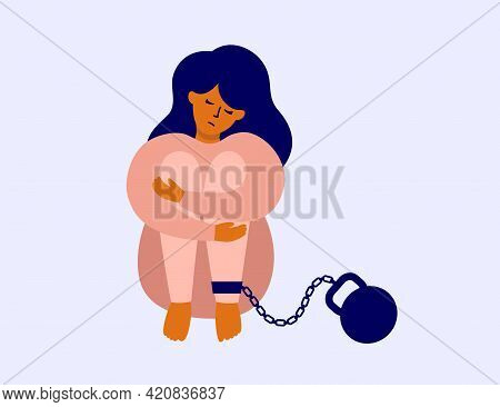 Unhappy Woman Chained With Weight Sitting Hugging Her Knees. Burden Of Responsibility, Debt, Guilt C