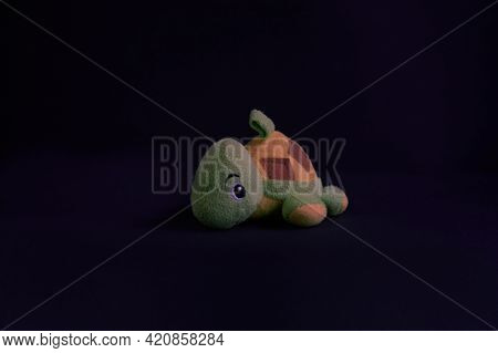 Toys, Soft Toys For Children. Soft Toy Turtle Isolated On Black Background