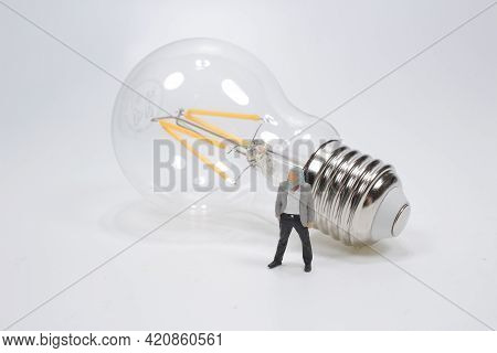 Figure With Light Bulb, Concept Of New Ideas With Inno