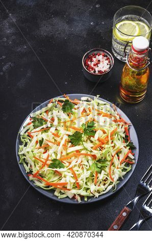 Coleslow Cabbage Salad With Carrot On Grey Kitchen Table. Top View, Copy Space