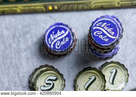 Roseville, Mn, Usa, 02.04.2021 - Fallout Board Game Components On Table Desk Close Up. Caps Tokens N