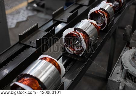 Electric Motors Manufacture In Industrial Company - Stators On Assembly Line Of Semi-automated Manua