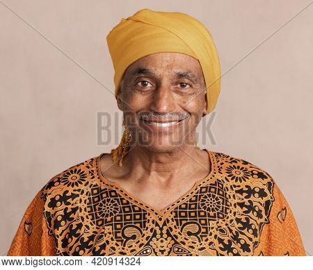 Happy mixed Indian senior man wearing a yellow turban mockup