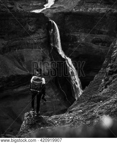 Photographer at the Haifoss waterfall, Iceland