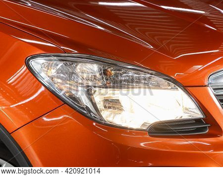 Novosibirsk, Russia - May 16, 2021: Opel Mokka, Headlight Of A Modern Popular Car Close-up. Shiny Gl