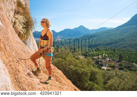Woman Stands On A Large Rock And Belays The Climber, Climbing In Turkey, Partner Belaying, Belay Dev