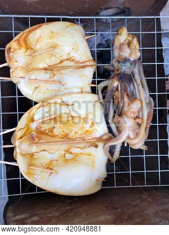Top View Close Up Fresh Squid Grill On The Clay Firepot For Dinner Bbq