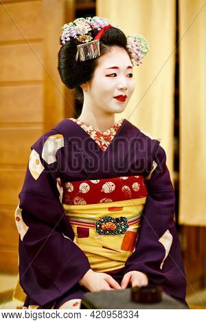 Kyoto, Japan - 18 May, 2015: Maiko Apprentice Showing Japanese Traditional Dance. Maiko Is An Appren