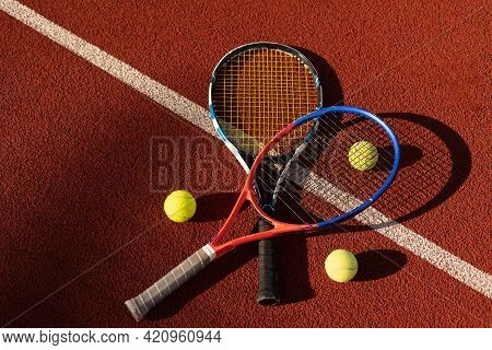 A Tennis Racket And New Tennis Ball On A Freshly Painted Tennis Court
