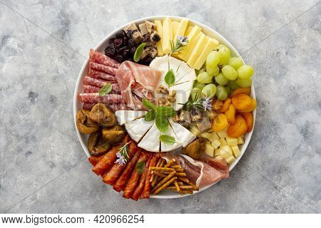 Charcuterie Assortment, Variety Of Cheeses And Salami, Prosciutto And Dried Fruits, Figs, Apricots, 