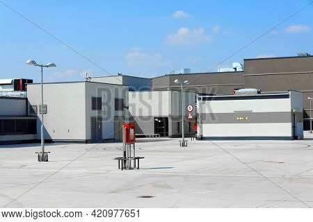 Car Parking Lot Area on Deck Floor of Shopping Mall, Perspective View Empty of Car Park Structure Building at Department Store. Auto Service Parking Lots