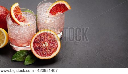 Fresh citrus lemonade with mint and crushed ice. Bood orange, lime, lemon. With copy space