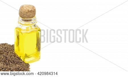 Cumin Essential Oil. Glass Bottle Of Cummin Oil. Caraway In A Sack Of Isolated On A White Background