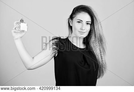 Share The Secret. Pretty Woman Hold Perfume. Perfumery Shop. Woman With Bottle Of Perfume. Girl Appl
