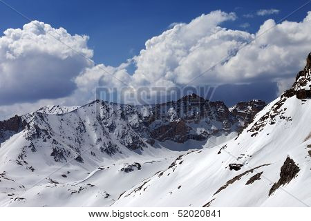 Snowy Mountains And Blue Sky With Cloud In Sunny Spring Day