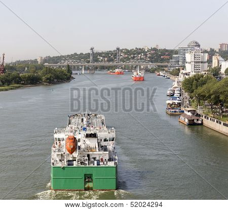 Multi-colored Ships Pass Under The Drawbridge