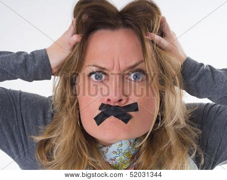 furious woman with sticky tape on her lips, shut up, do not spreed negative emotions