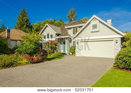 Fragment of a luxury house with a garage door in Vancouver, Canada. Horizontal orientation.