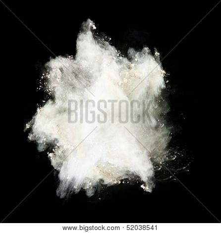 Freeze motion of white dust explosion isolated on black background