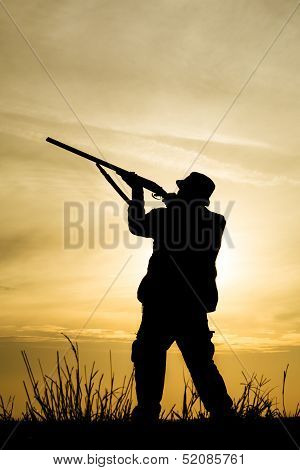Hunter With Shotgun in Sunset
