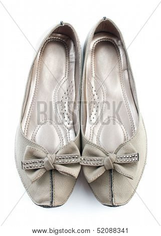Pair of female casual grey flat shoes isolated on white background