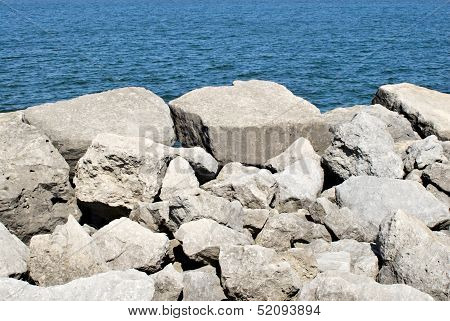 White Rocks On Blue Water