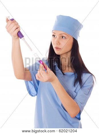 Female Doctor Holding A Doser And Tube In Her Hand.