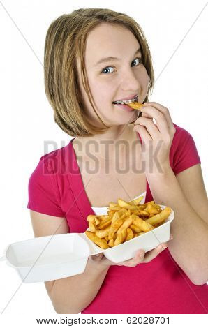 Teenage eating french fries isolated on white background