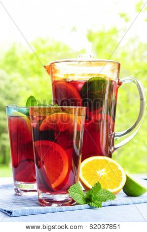Refreshing fruit punch beverage in pitcher and glasses
