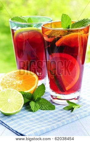 Refreshing fruit punch in two glasses outside