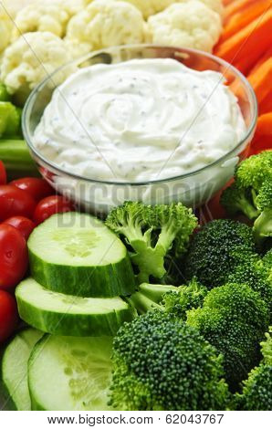 Platter of assorted fresh vegetables with dip