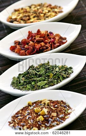 Herbal wellness dried tea in four bowls