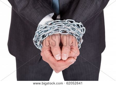 Businessman Hands Bound In Chains