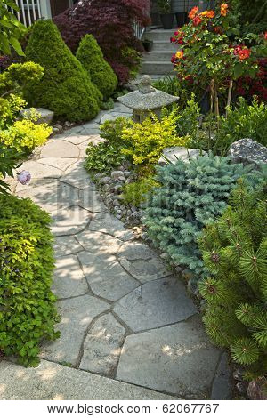 Natural flagstone path landscaping in home garden