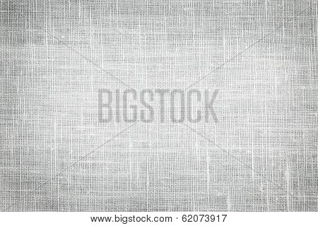 White linen woven fabric background or texture with dark vignette