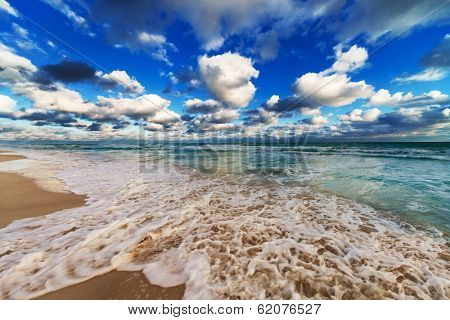 ocean coast with waves at sunrise