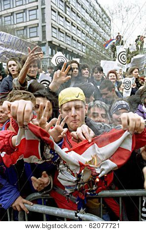 BELGRADE, SERBIA, 30 MARCH 1999 -- Serbs burn an American flag during a mass anti-NATO protest held  today in the capital Belgrade. Thousands turned out to hear speeches condemning NATO airstrikes.