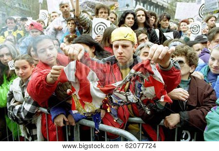 BELGRADE, SERBIA, 30 MARCH 1999 -- Serbs burn an American flag during a mass anti-NATO protest held  today in the capital Belgrade. Thousands turned out to hear speeches condemning NATO airstrikes.