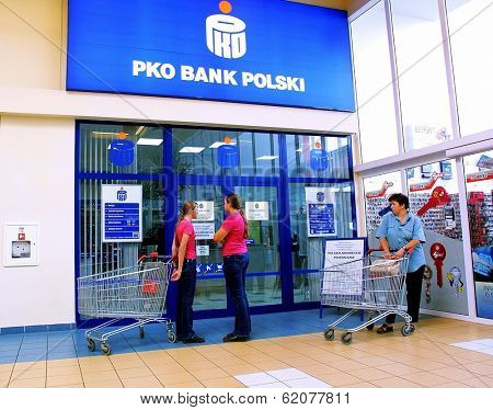 KRAKOW, POLAND, 25 OCTOBER 2003 -- A customer withdraws money from a Bank PKO BP automated teller cash machine. Bank PKO is one of Poland's leading financial institutions.