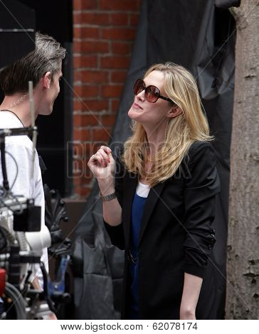 NEW YORK CITY - APRIL 15: Former SVU star Stephanie March (R) admires a tattoo on the arm of a crew member on the set of 